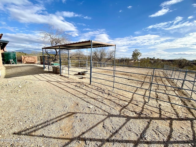 exterior space with an outdoor structure and a rural view