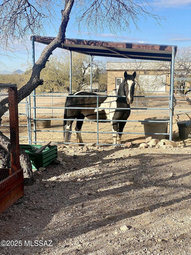 view of stable featuring a rural view