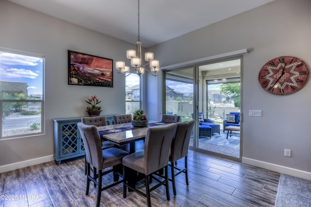 dining room featuring a notable chandelier and dark hardwood / wood-style floors