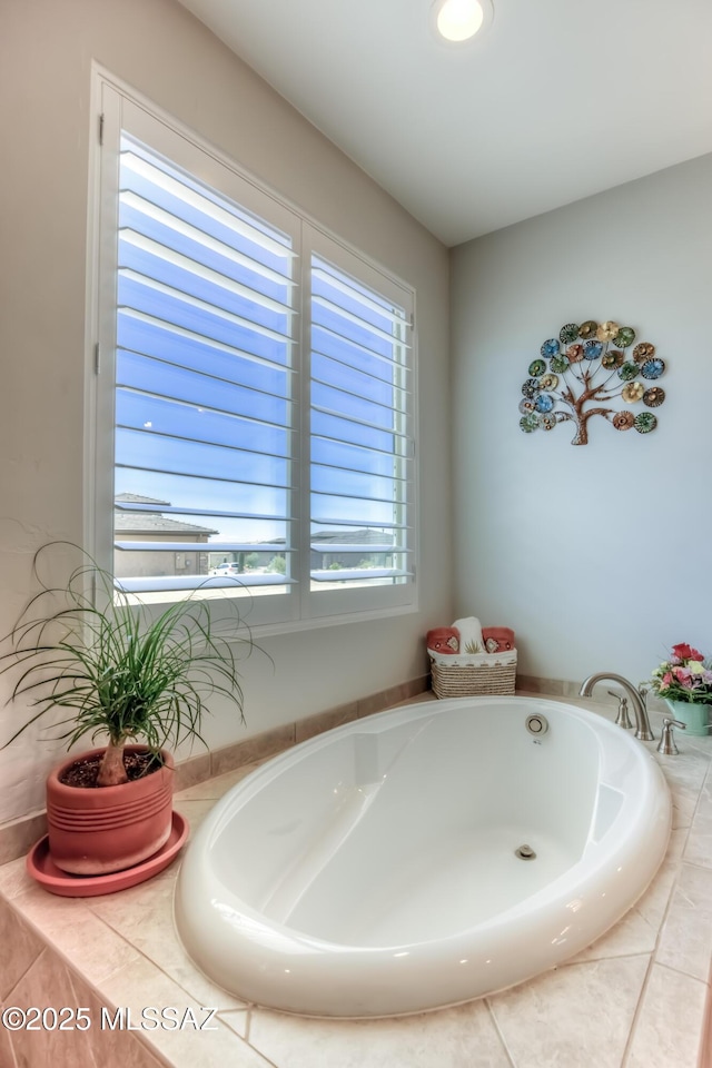 bathroom with tiled bath