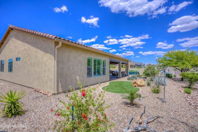 back of house featuring a patio area