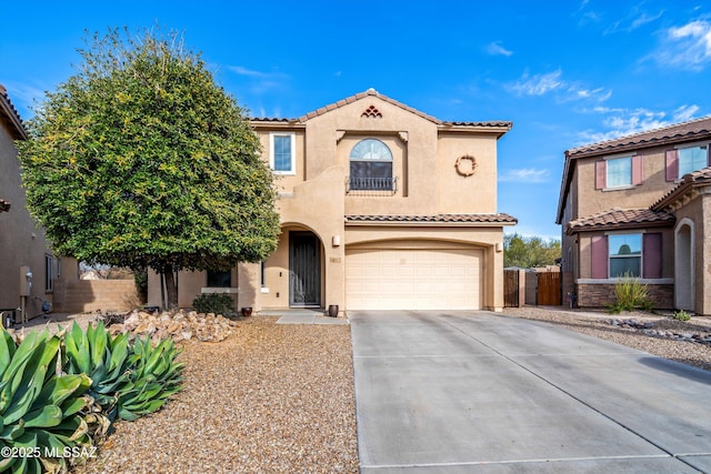 mediterranean / spanish-style home featuring fence, driveway, an attached garage, stucco siding, and a tile roof