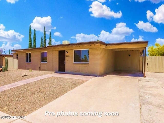 view of front of home featuring a carport