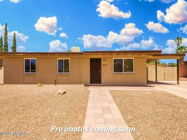 view of front of property with a carport