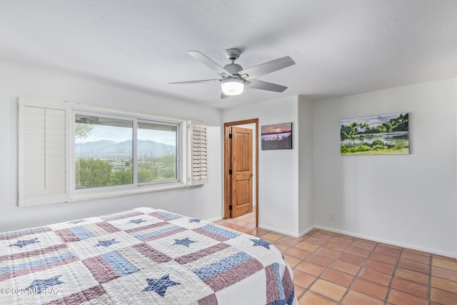 tiled bedroom with ceiling fan