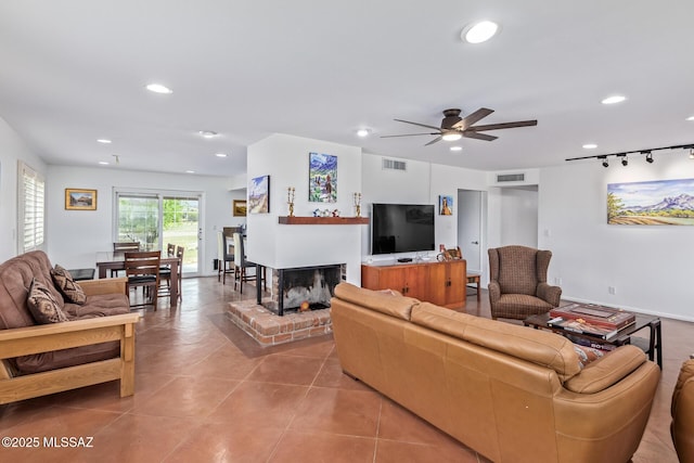 5485 N Blue Bonnet Rd, Tucson, AZ 85745 - living area featuring recessed lighting, a ceiling fan, light tile patterned flooring, and a fireplace