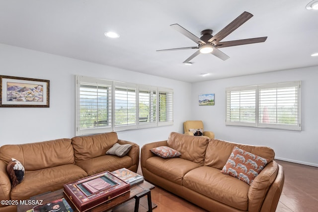 living room featuring ceiling fan and tile patterned floors