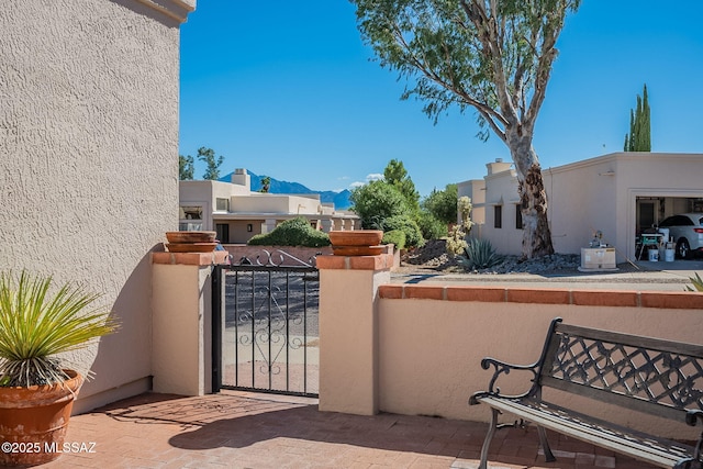 view of gate with a mountain view