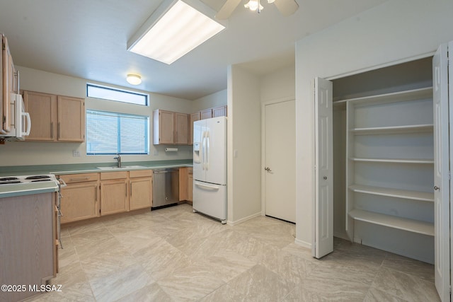 kitchen featuring ceiling fan, sink, light brown cabinetry, and white appliances