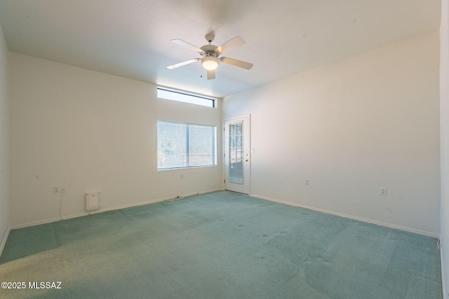 spare room with carpet floors and ceiling fan