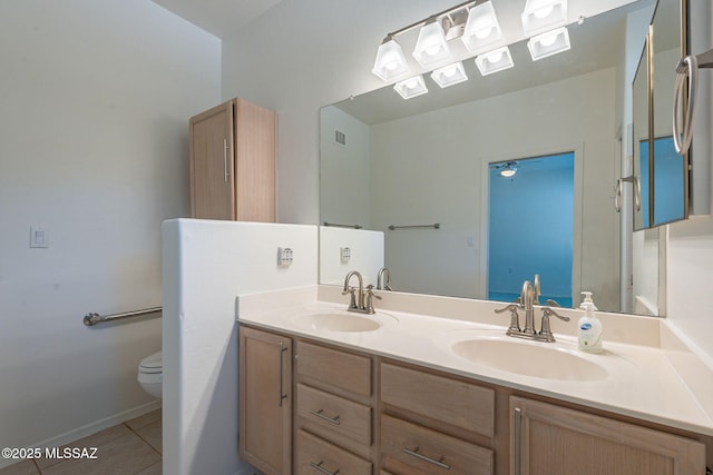 bathroom with tile patterned floors, toilet, and vanity