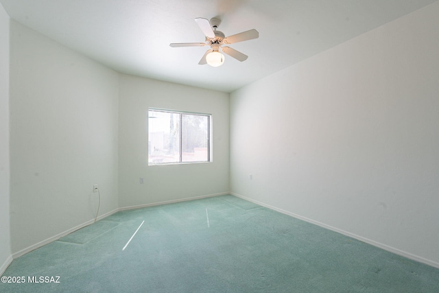 carpeted empty room featuring ceiling fan