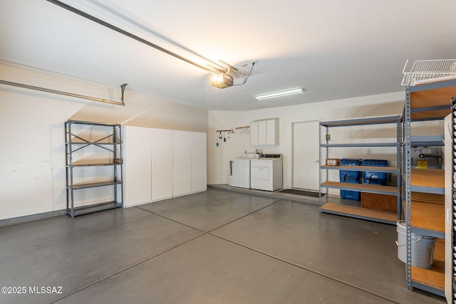 garage featuring a garage door opener and washing machine and dryer