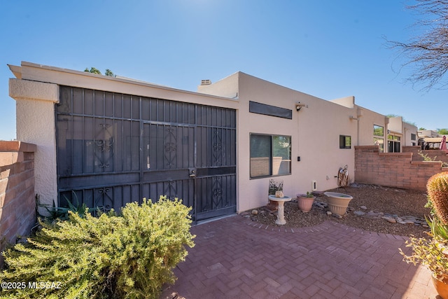 rear view of property featuring a patio area