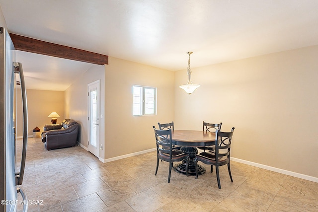 dining room with beamed ceiling