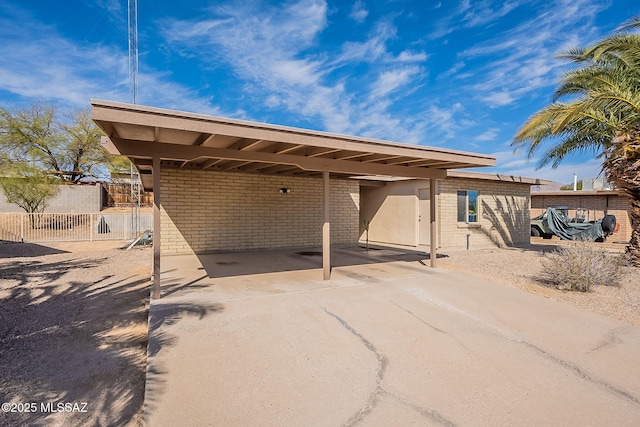 rear view of house featuring a carport