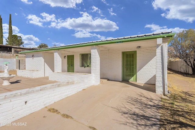 back of house featuring a patio area