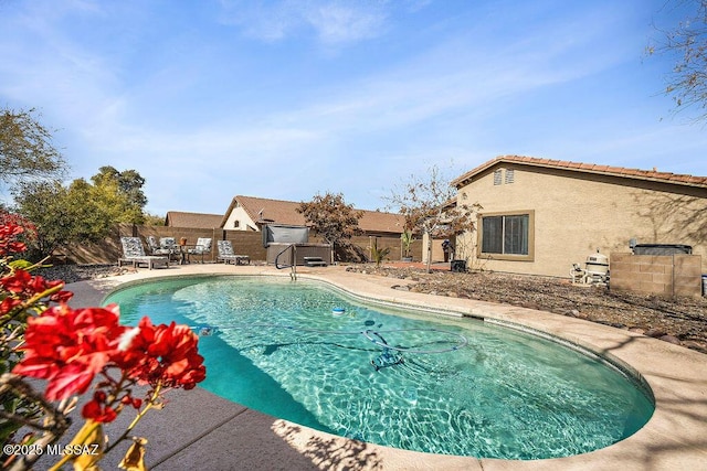 view of pool with a fenced backyard, a fenced in pool, and a patio area