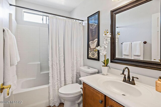 bathroom featuring shower / tub combo, toilet, and vanity