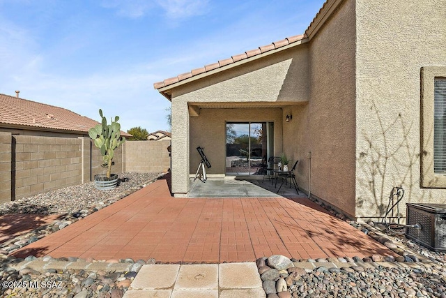view of patio featuring central AC unit and a fenced backyard