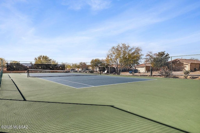 view of tennis court with fence