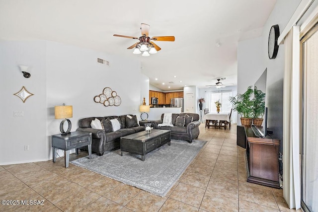 living area with light tile patterned floors, visible vents, and a ceiling fan