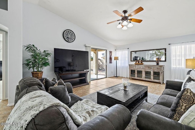 living room featuring lofted ceiling, light tile patterned floors, and ceiling fan