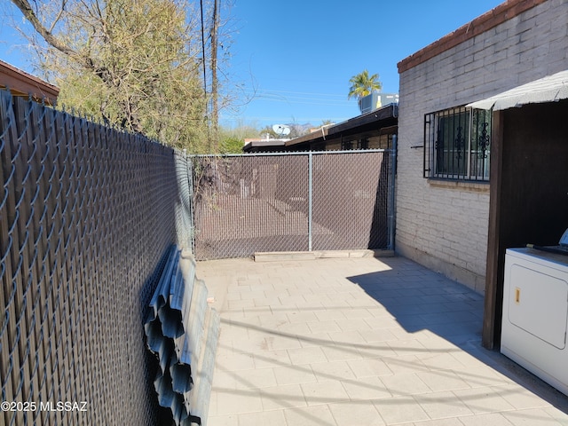 4016 E Fairmount St, Tucson, AZ 85712 - exterior space with a fenced backyard and washer / dryer