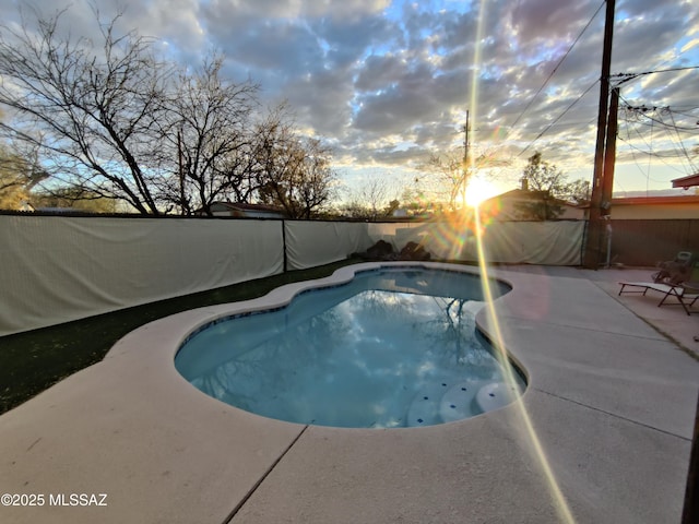 4016 E Fairmount St, Tucson, AZ 85712 - pool at dusk featuring a fenced backyard, a fenced in pool, and a patio