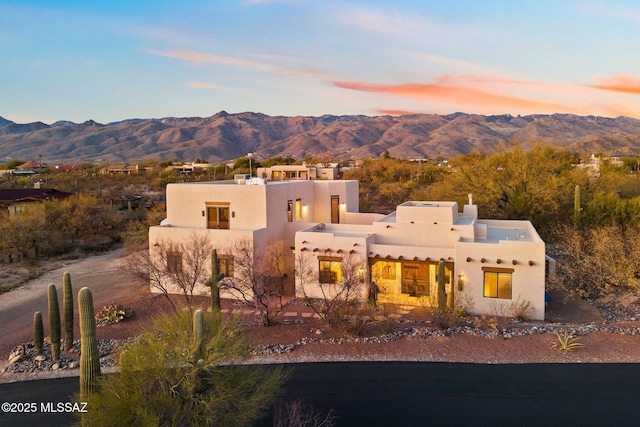 southwest-style home with a mountain view