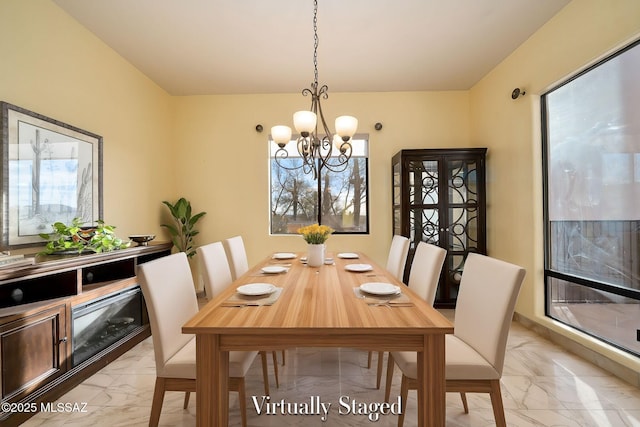 dining room with a notable chandelier