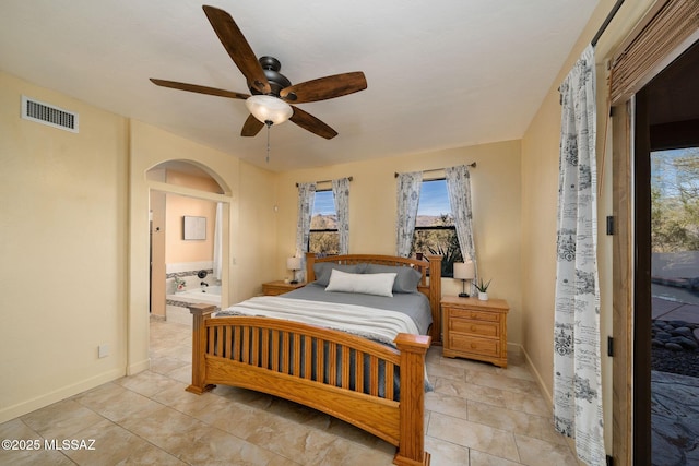 bedroom with ensuite bath, access to outside, and ceiling fan