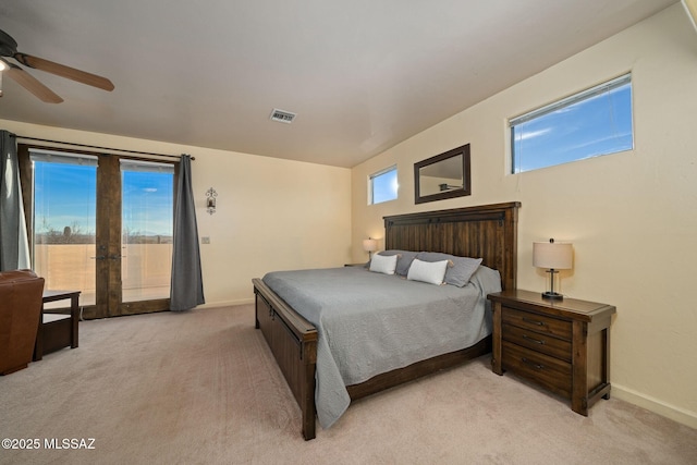 bedroom featuring access to outside, light colored carpet, and french doors