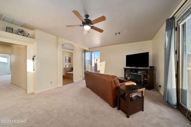 carpeted living room featuring ceiling fan