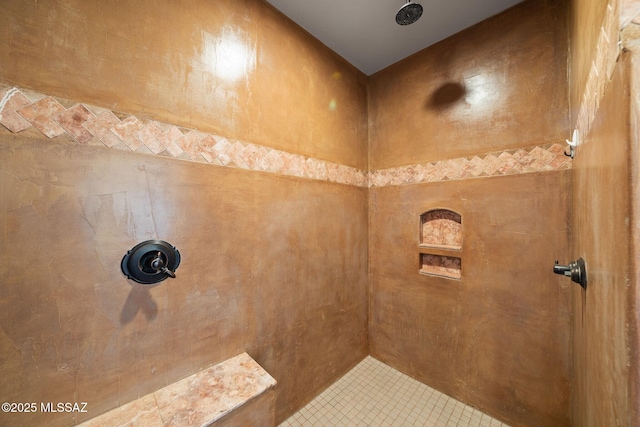 bathroom featuring tiled shower