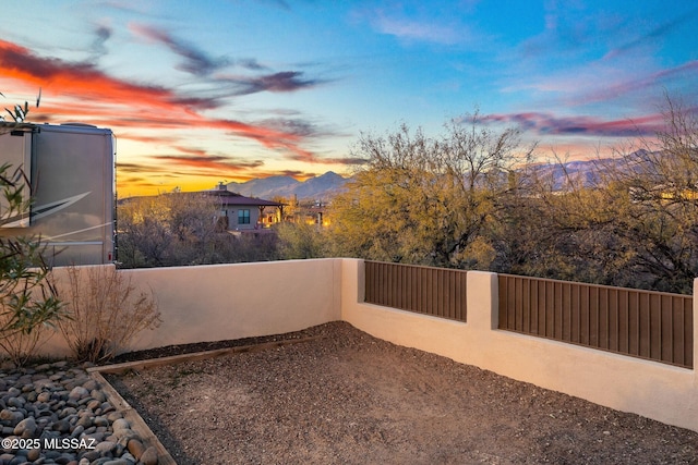 yard at dusk with a mountain view