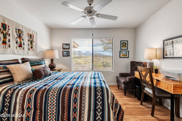 bedroom featuring ceiling fan and light hardwood / wood-style floors