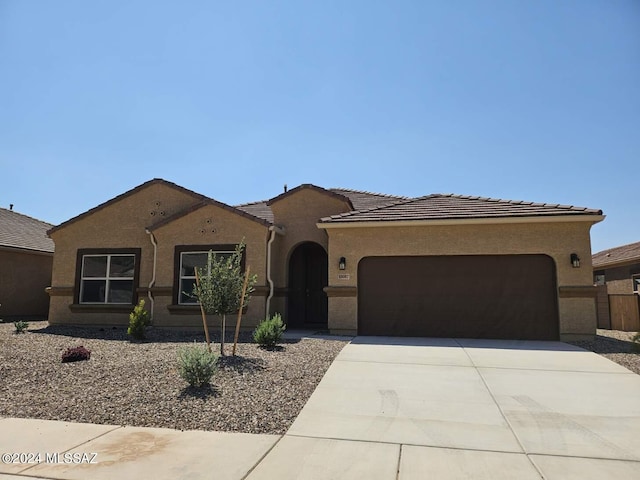 view of front of property with a garage