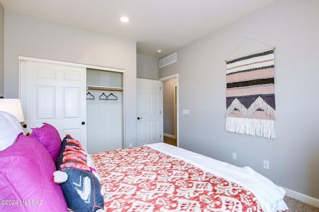 carpeted bedroom with a closet