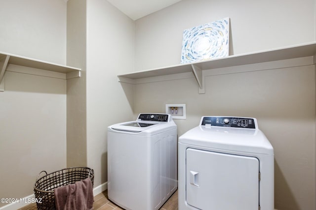 washroom with independent washer and dryer