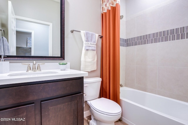 full bathroom featuring vanity, shower / tub combo with curtain, and toilet