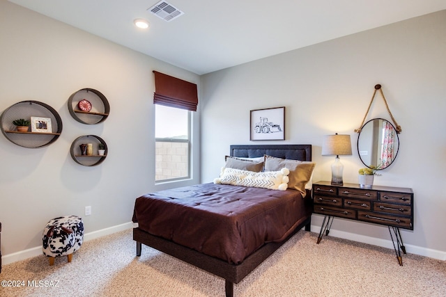 bedroom featuring light carpet