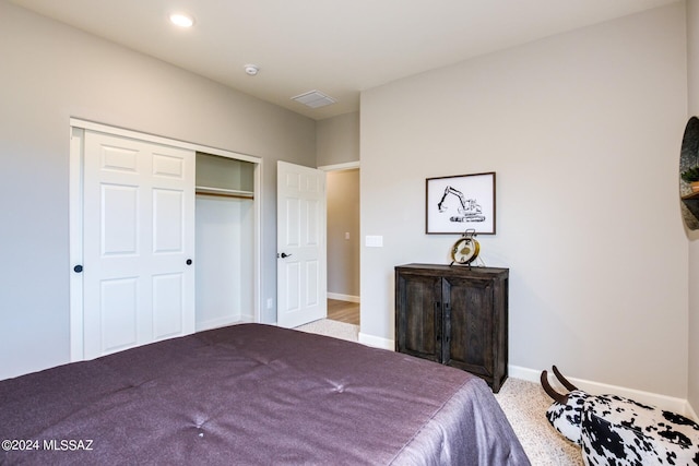 carpeted bedroom featuring a closet