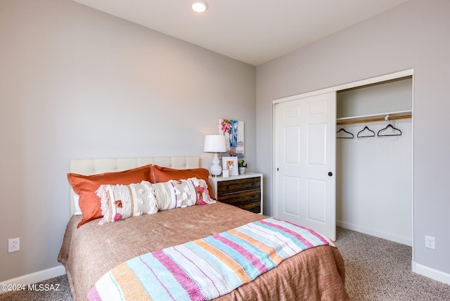 bedroom with carpet flooring and a closet