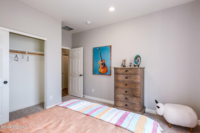 carpeted bedroom with a closet