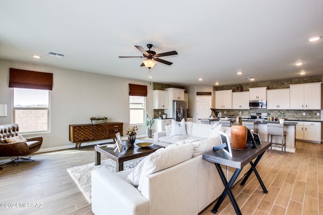 living room with ceiling fan