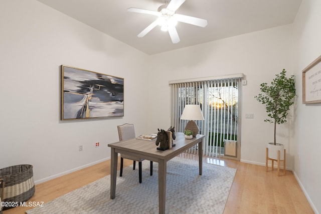 office with ceiling fan and light hardwood / wood-style flooring