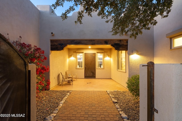 property entrance featuring a patio area