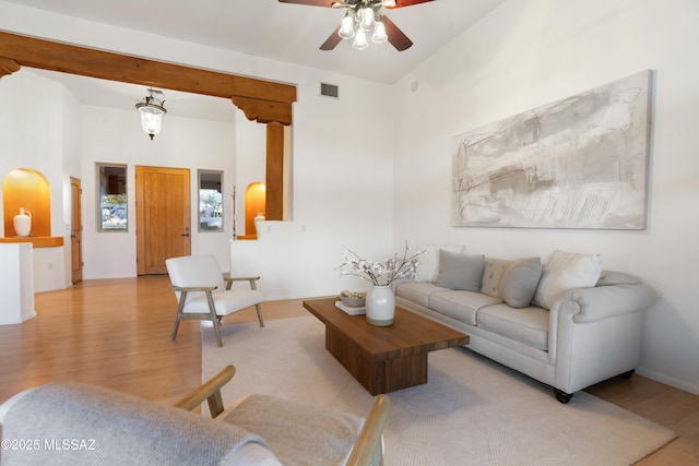 living room featuring light hardwood / wood-style flooring and ceiling fan