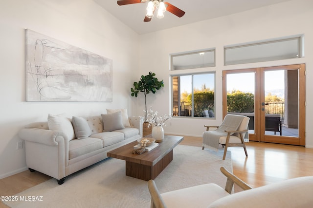 living room featuring light hardwood / wood-style floors and french doors